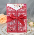 Elegant laser-cut red wedding invitation with satin bow and floral painted insert - Pearlescent Red