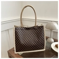 Retro brown tote bag with golden geometric pattern and cream woven handles in a cozy setting - Floral Coffee