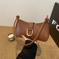 Brown leather baguette underarm bag with gold D-ring buckle and knotted shoulder strap - Brown
