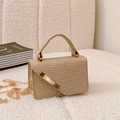 Mini golden brown woven handbag with metallic chain and elegant handle on soft fabric - Gold