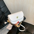 White faux leather saddle bag with gold lock and silk scarf wrapped chain strap - White
