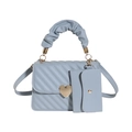 Light blue quilted mini square handbag with heart buckle and cloud-like handle detail - Blue