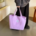 Minimalist lilac canvas tote bag with leaf pattern label and comfortable shoulder strap - Purple