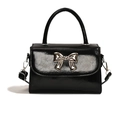 Mini borsa a mano in pelle verniciata nera con fiocco in metallo argento e manico - Nero