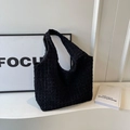 Minimalist black tote bag with textured bubble fabric and wide shoulder strap - Black