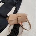 Chic beige crossbody bag featuring a large gold buckle and adjustable shoulder strap - Khaki