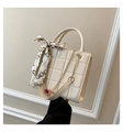 Detail of cream quilted tote bag featuring silk scarf handle and golden chain strap - White