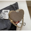 Champagne gold heart-shaped crossbody bag with glitter texture and silver chain strap - Gold