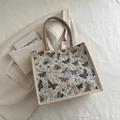 Bolso tote de jacquard vintage con coloridos patrones de mariposas y asas de cuerda tejida - Beige