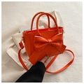 Vibrant orange patent leather handbag with decorative bow and detachable shoulder strap - Orange