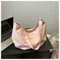 Minimalist light pink tote bag with gold lettering shown on a dark desk - Pink