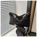 Detail of black sequined handbag with shiny reflective surface and metal chain strap - Black