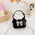 Mini black PU leather handbag for kids with a silver metallic bow and chain strap - Black