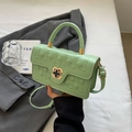 Mint green quilted crossbody bag with clover metal lock and adjustable strap - Green