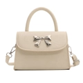 Elegant cream-white crossbody bag with silver bow accent and lychee texture finish - Off White