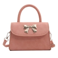 Pink fashion handbag with metallic bow buckle and adjustable crossbody strap - Pink