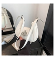 Chic white leather shoulder bag featuring a silver metal flower buckle and saddle shape - White