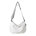 White crescent canvas shoulder bag with black adjustable strap and fashion label - White and Black