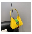 Chic saddle shoulder bag in yellow and green leather with a silver bow ornament - Large / Yellow