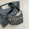 Fashionable black and white leopard print hobo bag with adjustable nylon strap and metal buckle - Leopard White