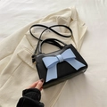 Retro black handbag featuring a large light blue bow and a thin crossbody strap - Black with Blue