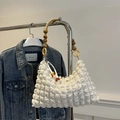 Chic cream white pleated shoulder bag featuring unique wooden bead strap and bubble texture - Off White