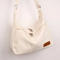 Chic cream nylon crescent hobo bag with double front zippers and wide shoulder strap - White