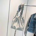 Light gray drawstring tote bag with ruffle shoulder strap and rhinestone embellishments - Gray