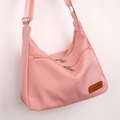 Pink lightweight nylon crossbody bag with adjustable strap and multiple zipper pockets - Pink