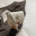 Chic white quilted crossbody bag with silver star emblem and elegant chain strap - Off White