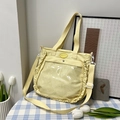 Light yellow canvas tote bag with transparent front pocket and ruffle lace side trim - Yellow