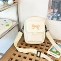 Borsa a tracolla in tela bianco crema con ricamo a fiocco e tracolla larga - Bianco
