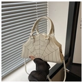 Close-up of white spider web embroidery on trapezoid handbag with serrated top edge - White