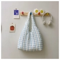Blue and white checkered bubble texture tote bag hanging on a minimalist wooden hook - Blue & White