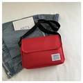Minimalist red oxford cloth crossbody bag with adjustable strap and decorative label - Red