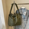 Army green nylon drawstring bucket bag with large front pockets and adjustable strap - Army Green