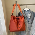 Minimalist orange nylon tote bag with drawstring closure and outer utility pockets - Orange