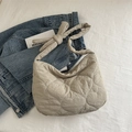 Chic beige quilted tote bag featuring heart patterns and trendy knotted shoulder straps - Khaki