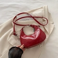 Red hobo crescent bag in glossy faux leather with metal chain and flower charm - Red