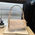 Quilted beige underarm shoulder bag with chic knot strap and premium leather texture - Khaki