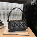 Chic black quilted shoulder bag with unique knot detail on the strap for women - Black