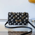 Fashionable denim crossbody bag with black and white checkerboard pattern and fringe details - Black