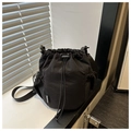 Detail view of durable black nylon crossbody bag featuring a FASHION label and side pocket - Black