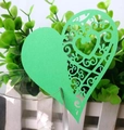 Detail of green laser-cut heart paper place card with intricate hollow vine patterns - Dark Green