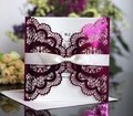 Laser cut rose red wedding invitation with white silk ribbon bow and envelope - Reflective Rose Red