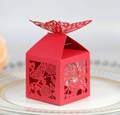 Elegant red laser-cut butterfly wedding candy box with floral patterns on white plate - Red