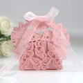 Pink laser-cut butterfly wedding favor box with a soft pink ribbon on a light surface - Pink