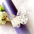 Elegant laser cut 3D cream butterfly napkin ring around a decorative purple scroll - Ivory