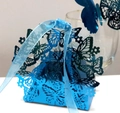 Laser-cut butterfly wedding favor box in blue with matching ribbon and heart detail - Reflective Blue
