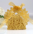 Elegant gold laser-cut candy box with butterfly hollow patterns and a satin ribbon bow - Gold Yellow